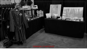 tables and clothes set up at an antique show